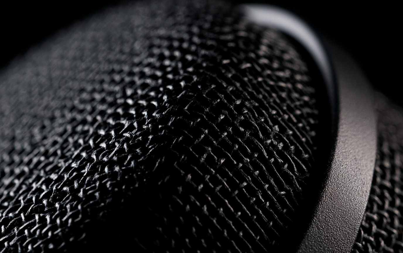 Microphone grille macro with a drawn speech waveform, annotation spans and playhead.